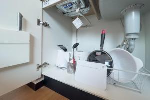 a hospital room with a white counter with a machine at Elegant House in Tokyo