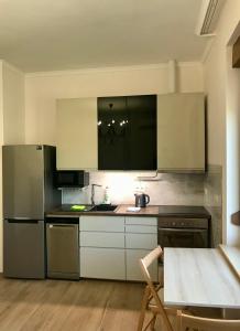 Kuchyňa alebo kuchynka v ubytovaní Deviza Apartments
