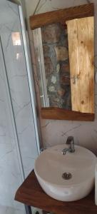 a bathroom with a sink and a mirror at Villa Old House BN in Bitola