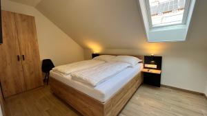 Postel nebo postele na pokoji v ubytování Rezidex Apartmanház