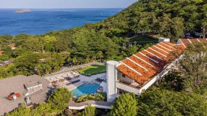 an aerial view of a house with a swimming pool at Villas Sol Beach Resort - All Inclusive in Playa Hermosa