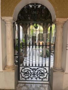 an ornate gate to a courtyard in a building at Hostal Palacio del Corregidor in Córdoba