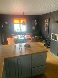 a kitchen with a wooden counter top in a room at Trivelig villa med innendørs peis in Fredrikstad