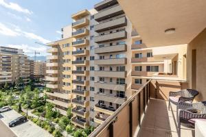 a balcony with a view of a building at 5th Floor Executive Apartment with Balcony and Free Parking in Braşov