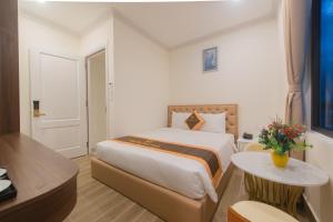 Postel nebo postele na pokoji v ubytování BẢO DUY HOTEL 5