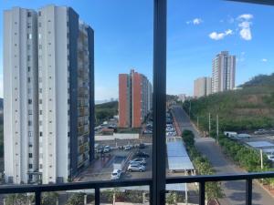 a view from a window of a parking lot at Para estrenar agradable apartamento acogedor in Cúcuta
