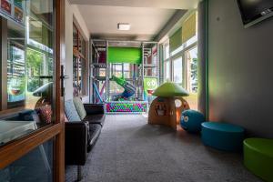 a room with a play room with a slide at Hotel Cztery Pory Roku in Głogów Małopolski