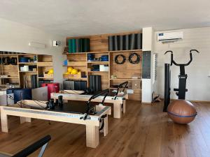 a room with a ping pong table and a gym at CASA VOLA in Cuneo