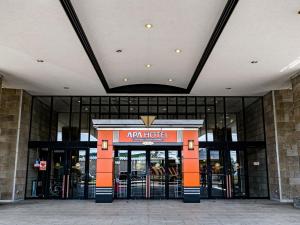 an entrance to an amazon hotel with its doors open at APA Hotel & Resort Sapporo in Sapporo