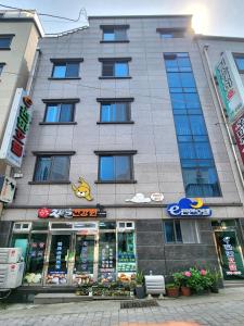 a building with a store in front of it at e comfy Hotel in Ulleung