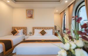 Postel nebo postele na pokoji v ubytování BẢO DUY HOTEL 5