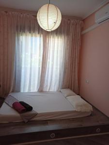 a bed in a room with a large window at House Laguna Roja in Torrevieja
