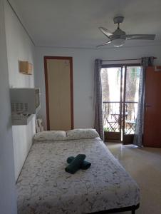 Posteľ alebo postele v izbe v ubytovaní Estudio Sota-Piscina