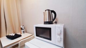 Kohvi ja tee valmistamise võimalus majutusasutuses Sujeongjang Inn
