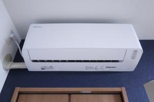a white printer sitting on top of a counter at Furinkyo・楓林居 5号館 in Osaka