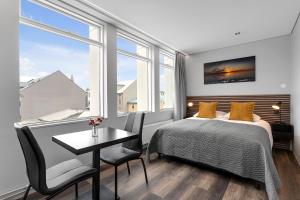Postel nebo postele na pokoji v ubytování ALVA Apartments + 37 fotografií