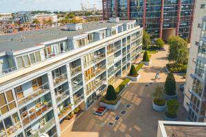 an aerial view of a building with a courtyard at Stunning Modern Apartment in the Gasworks in Dublin