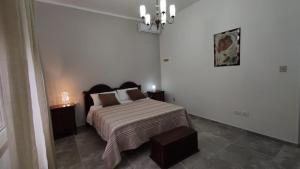 Кровать или кровати в номере Villa in campagna vicina al mare Bonerelax