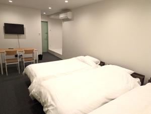 Center Point In Kanazawa客房内的一张或多张床位