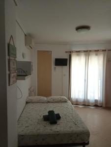 a bedroom with a bed and a large window at Estudio Caballo-Piscina in Denia +54 photos