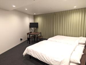 Center Point In Kanazawa客房内的一张或多张床位