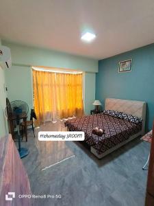 a bedroom with a bed and a window at Ocean view resort homestay near beach free wifi,cucckoo 3ROOM in Port Dickson