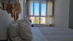 Posteľ alebo postele v izbe v ubytovaní Neptuno Torrecilla Beach