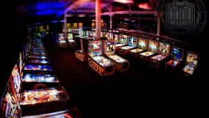 a bunch of slot machines lined up in a casino at Private Grannyflat Room In Maroubra in Sydney