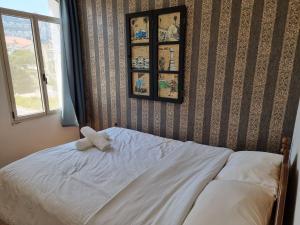 Postel nebo postele na pokoji v ubytování Haifa Hostel