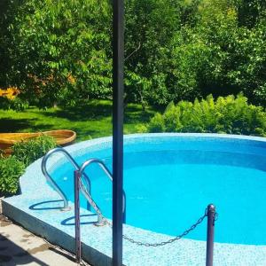 a swimming pool with a chain around it at Villa in Bishkek