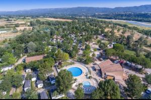 an aerial view of a resort with a pool at Vacances en Provence in La Roque-dʼAnthéron