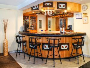 a bar with stools in a room at Embajadores Hotel in Lima +24 photos