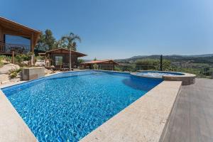 a swimming pool in a house at Fernandes Guest House Green Bungalow in Ponte de Lima