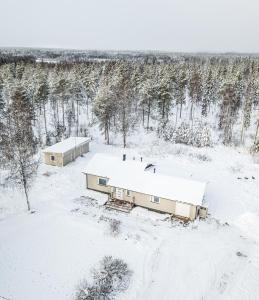 an aerial view of two buildings in the snow at Haistila in Ranua