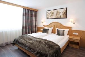 Postel nebo postele na pokoji v ubytování Haus Zangerl inkl Sommer-Karte Premium + 30 fotografií