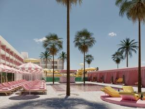 a resort with palm trees and pink lounge chairs at Los Felices Ibiza - New Opening 2024 in San Antonio Bay