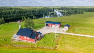 an aerial view of a house in a field at Hommala in Raiskio