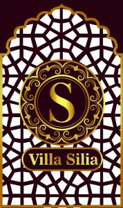 a gold and black sign with a s on a pattern at Villa Silia in Sharm El Sheikh