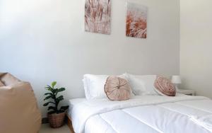 Postel nebo postele na pokoji v ubytování BAOBAB