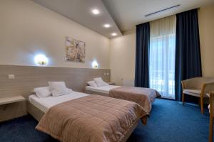 Ένα ή περισσότερα κρεβάτια σε δωμάτιο στο Hotel Torontal