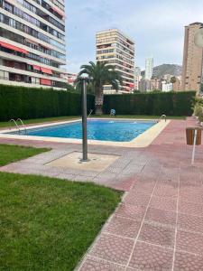 a swimming pool in the middle of a city at Benidorm Carolina Beach & Pool in Benidorm