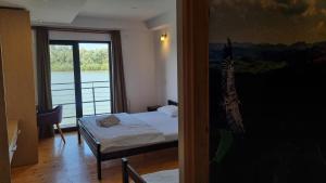 Letto o letti in una camera di B&B Botel Charlie