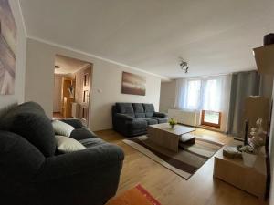 a living room with a couch and a table at Apartmán Stráne in Martin