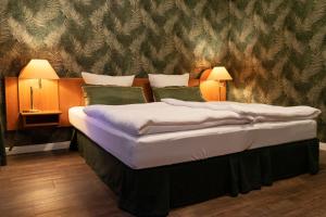 Postel nebo postele na pokoji v ubytování Rein Klassik Hotel