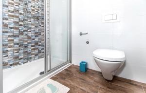 a bathroom with a toilet and a shower at Abby in Dramalj +6 photos