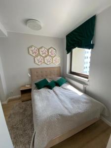 Ένα ή περισσότερα κρεβάτια σε δωμάτιο στο Margaret apartament