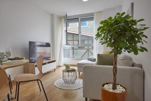 Televízia a/alebo spoločenská miestnosť v ubytovaní Canteras Suite Gran Canaria