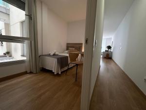 Postel nebo postele na pokoji v ubytování Canteras Suite Gran Canaria