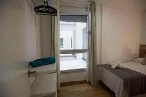 Postel nebo postele na pokoji v ubytování Canteras Suite Gran Canaria