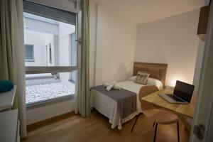 Postel nebo postele na pokoji v ubytování Canteras Suite Gran Canaria